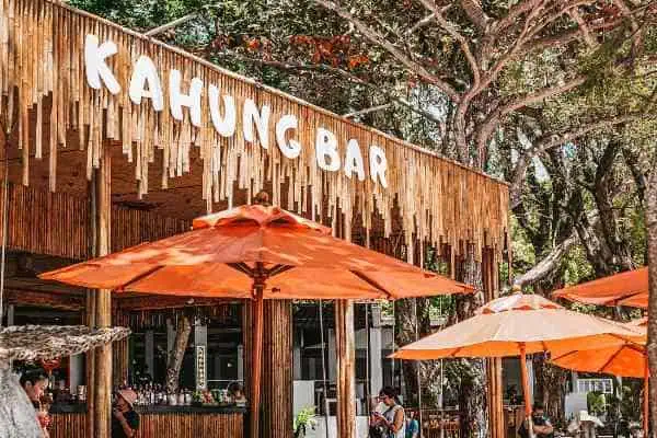 The Kahung Bar, a beachfront dining spot on Coral Island, featuring oceanfront views and a tranquil atmosphere ideal for relaxation.