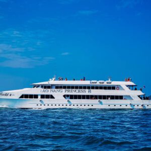 A large white ferry navigates the ocean waters near Ao Nang, Phuket, showcasing a serene maritime scene.