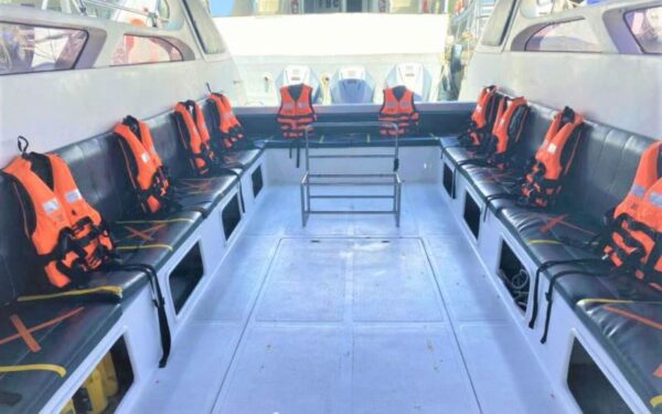 A ferry in Ao Nang, Phuket, featuring life jackets and seats arranged on the deck for passenger safety and comfort.