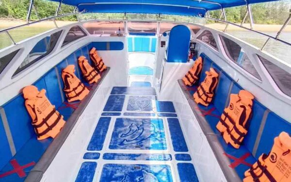 A ferry in Ao Nang, Phuket, featuring life jackets and seats arranged on the deck for passenger safety and comfort.