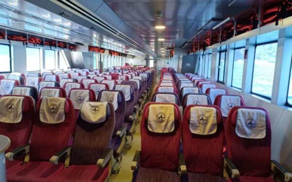 Empty ferry seats awaiting passengers on the ferry to Ao Nang, highlighting a moment of stillness and anticipation.