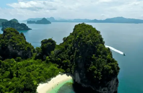 Tranquil beach with palm trees on Koh Yao Noi in Thailand.