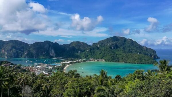 Breathtaking Phi Phi Island in Thailand, highlighting its natural beauty with lush hills and tranquil turquoise waters.