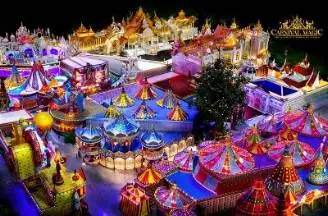 A vibrant carnival model illuminated by numerous colorful lights, showcasing a festive and lively atmosphere.