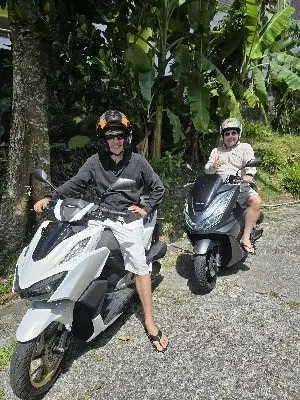 Honda PCX 160 scooter at a scenic viewpoint overlooking the Andaman Sea near Promthep Cape.