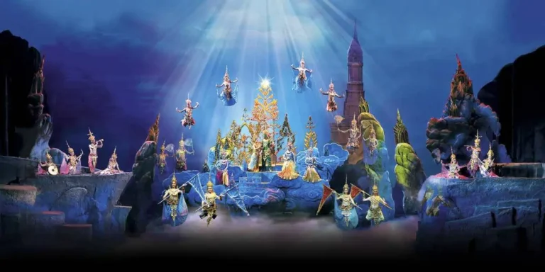 Mermaids gracefully swimming through the ocean with shimmering tails, surrounded by vibrant sea life, in the Siam Niramit Show in Phuket.