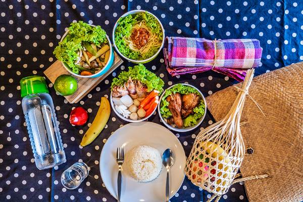 A well-prepared table showcasing an enticing spread of food and drinks, ready for enjoyment.