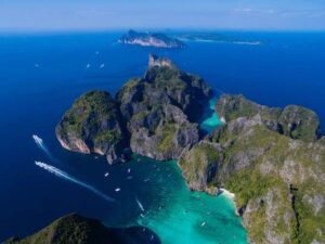 Stunning aerial perspective of Phi Phi Island, Thailand, featuring its vibrant coastline and tropical landscape, evoking James Bond adventures.