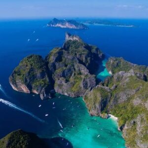 Stunning aerial perspective of Phi Phi Island, Thailand, featuring its vibrant coastline and tropical landscape, evoking James Bond adventures.