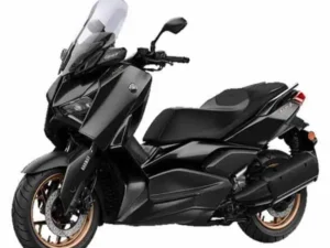 A black and gray Yamaha Xmax motorcycle displayed prominently against a clean white background.